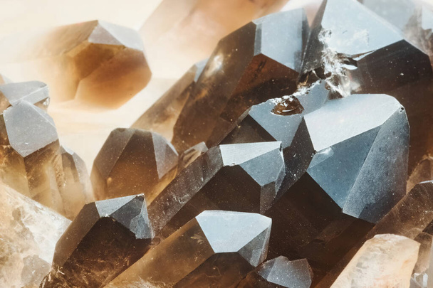 A close-up macro shot of a cluster of smokey quartz stones - Foto, afbeelding