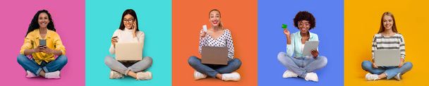 Happy millennial different females sit with laptop, phone and credit card, order purchase isolated on colorful background, studio, panorama. Great offer and ad, sale and online shopping for shopaholic - Fotoğraf, Görsel