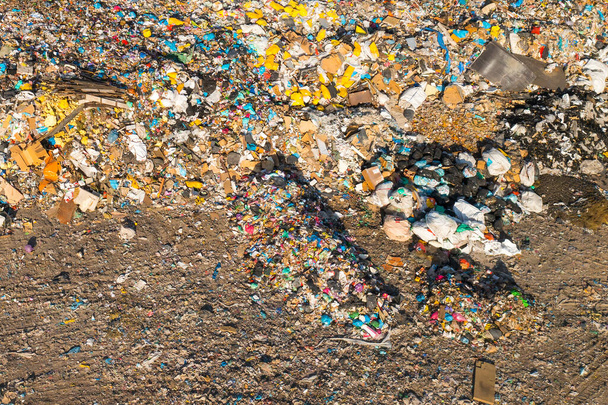 Large garbage dump with plastic bags and trash in the country. Environmental pollution concept. - Photo, Image
