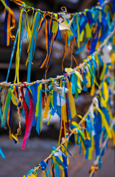 Ribbons in the colors of the national flag of Ukraine. Symbol of the Maidan, resistance and civil war in Ukraine. Tapes of the Ukrainian symbolism. Shallow depth of field, selective focus - Zdjęcie, obraz