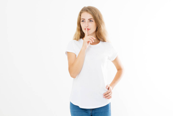 Shhh sign. Young woman showing shh gesture to keep a silent. Girl in template white t shirt keep a secret. Quiet place and silence time. Copy space - Photo, image