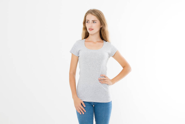 Young blonde woman with fit slim body in blank template t shirt and jeans isolated on white background. Skin and hair care. Copy space and mock up - Zdjęcie, obraz