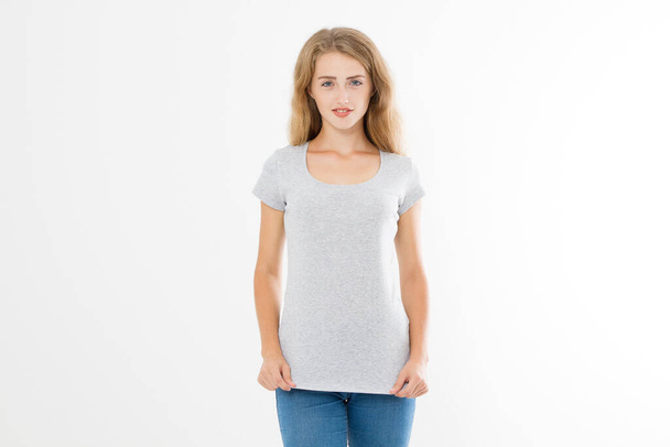 Young blonde woman with fit slim body in blank template t shirt and jeans isolated on white background. Skin and hair care. Copy space and mock up - Foto, Bild