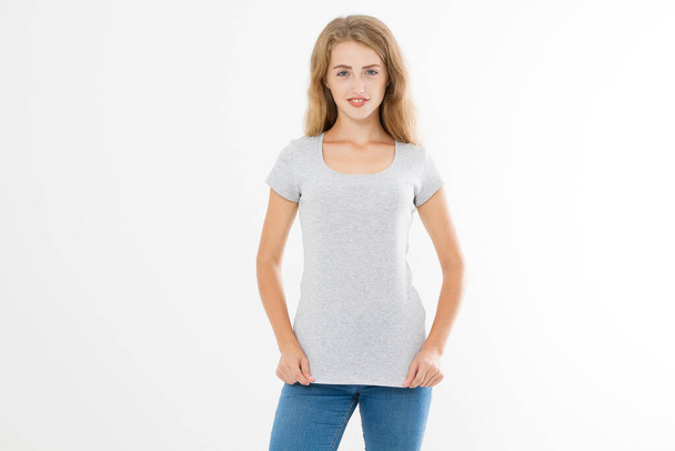 Young blonde woman with fit slim body in blank template t shirt and jeans isolated on white background. Skin and hair care. Copy space and mock up - Valokuva, kuva