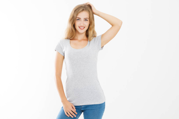 Young blonde woman with fit slim body in blank template t shirt and jeans isolated on white background. Skin and hair care. Copy space and mock up - Foto, imagen