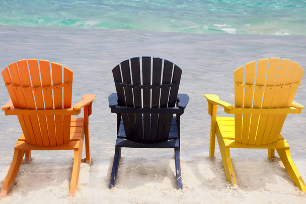 Three beach chairs on caribbean coast - Foto, immagini