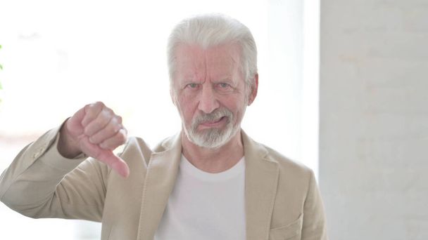 Portrait of Senior Old Man showing Thumbs Down - Foto, immagini