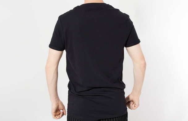 Back view close up of man in blank t-shirt, black t shirt on caucasian man closeup isolated - Фото, изображение