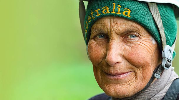 Elderly female hiker looking in the camera. Senior woman-climber is hiking in mountain. Caucasus mountains. Active retirement. Active lifestyle - Фото, зображення