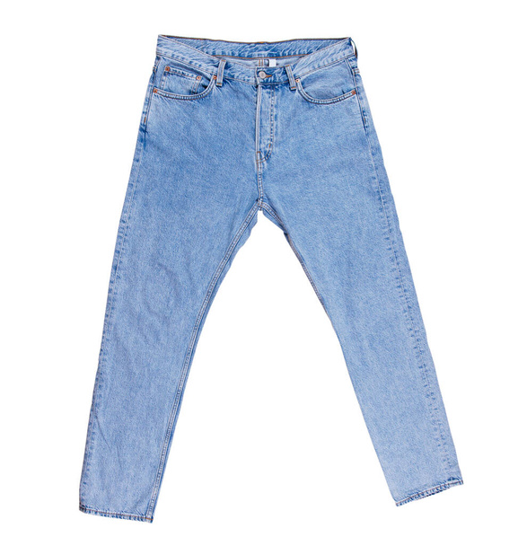 Denim kalhoty izolované, modré složené džíny izolované na bílém pozadí zblízka - Fotografie, Obrázek