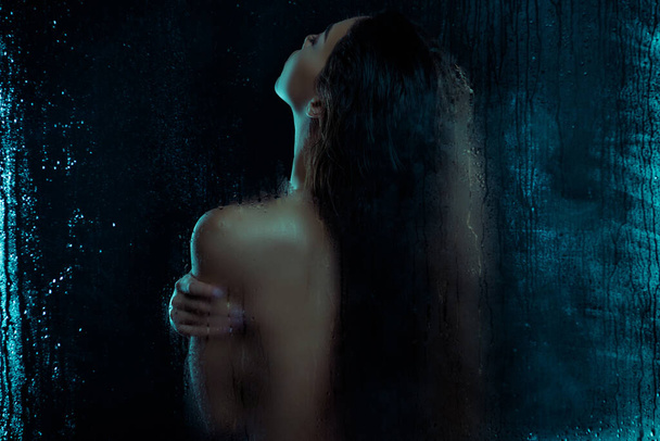 Back rear spine photo of lady wash body use pampering gel isolated on black color background with droplets moisture. - 写真・画像