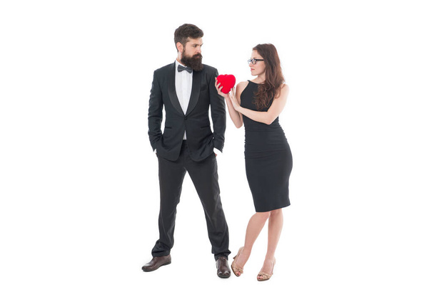 just married man and woman. valentines day. bearded man tuxedo and girl glasses. formal couple in love hold heart. engagement. elegant couple formal event. love and romance. special occasion. - 写真・画像