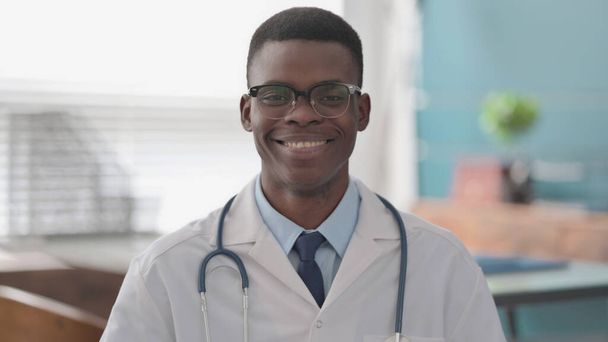 Portrait of African Doctor Smiling at Camera - Photo, image