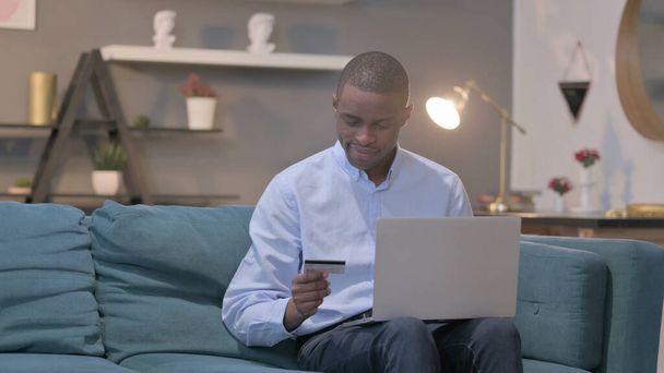 The Young African Man making Successful Online Payment on Laptop - Zdjęcie, obraz