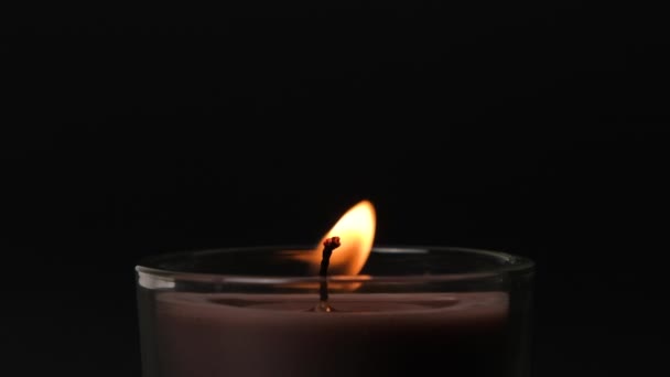 https://cdn.create.vista.com/api/media/small/605895600/stock-video-brown-single-candle-flickering-dark-side-view-candle-glass-candle?videoStaticPreview=true&token=