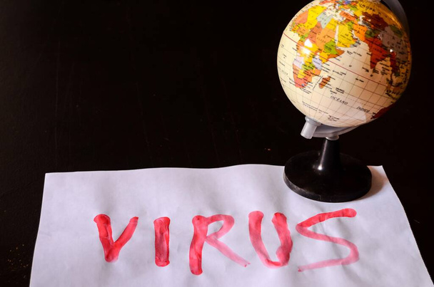 world globe with virus word  - Fotó, kép
