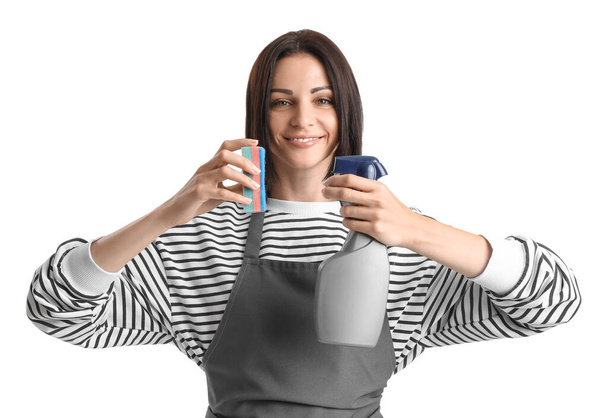 Beautiful woman with cleaning sponge and bottle of detergent on white background - Фото, зображення