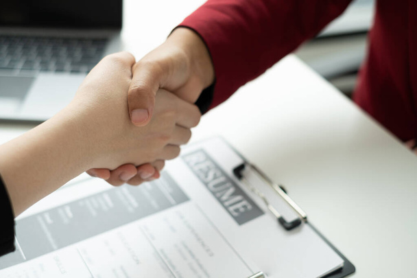 Employer shake hand with job applicants congratulates and welcomes new hires after successful negotiations for a job interview. Recruitment concepts. - Fotó, kép