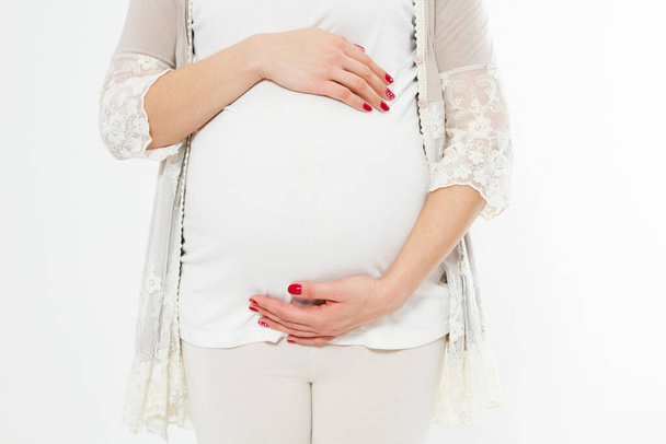 Young pregnant woman holds her hands on her swollen belly. Love concept. Happy event,birth of a child - Foto, Imagem