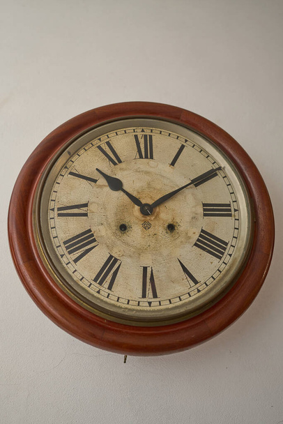 Details of an old clock on white wall - Photo, image