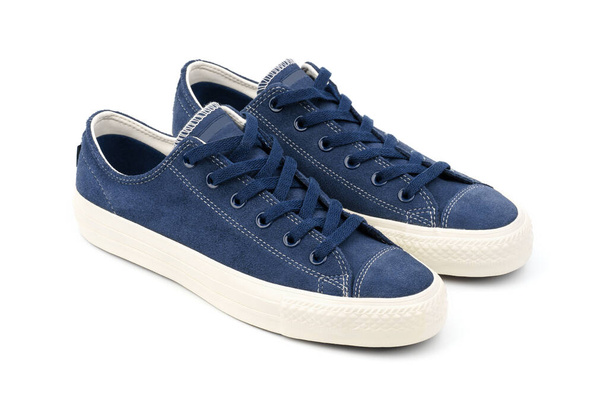 Blue sneakers on a colored background with copy space. Youth shoes. Keds. - Foto, Imagen