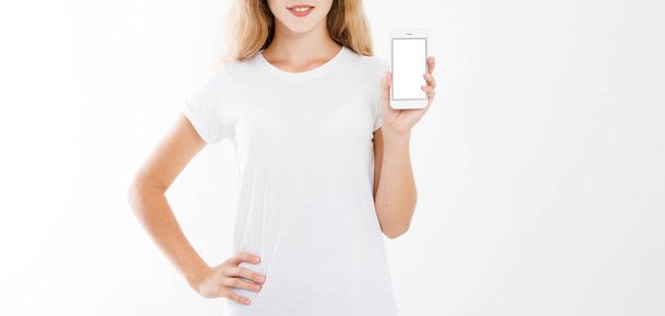 girl, woman in t-shirt holding blank screen mobile phone isolated on white background. Arm hold smartphone, copy space - Foto, Imagem