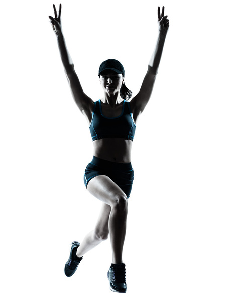 woman runner jogger jumping victorious silhouette - Foto, imagen