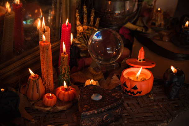 Halloween composition pumpkin orange candles, mystical design for home, interesting ideas for party, details of dcor - Valokuva, kuva