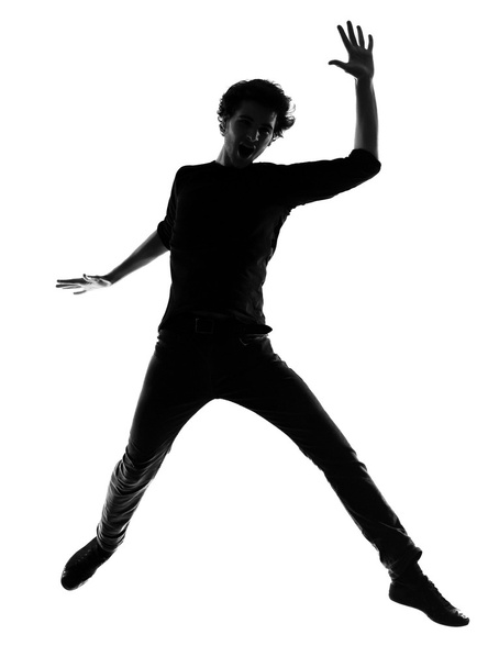 young man silhouette jumping happy - Foto, Imagem