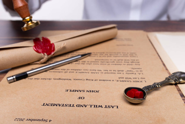 Lastwill Inheritance document Contract is approved by Lawyer to seal wax and stamp approval to finance and separate asset by justice law notary. They allocate insurance money real estate. copy space - Фото, изображение