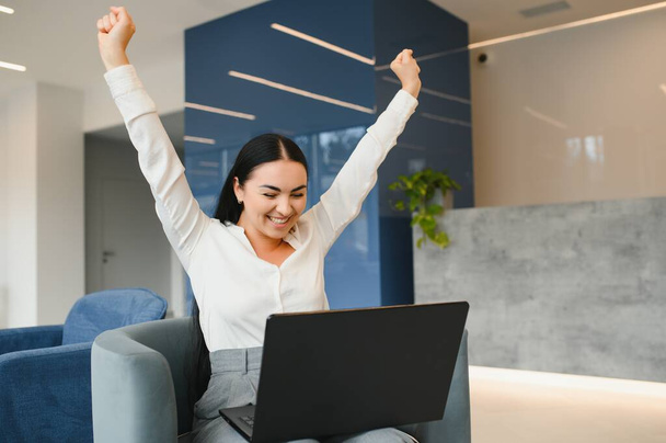 Great news. Win, success. Photo of crazy happy positive woman winner good mood victory work indoors. - Photo, Image