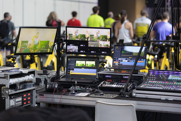 Multiple Monitors and other Professional Equipment for Lighting, Sound Technicians and Broadcast Operators in the BackStage of a Public Event. - Fotó, kép