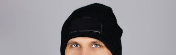 man in blank black winter hat isolated , mock up , copy space - Φωτογραφία, εικόνα