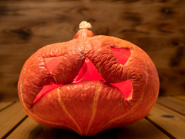 Pumpkin on a wooden background. Halloween pumpkin. Close-up. - Foto, Bild