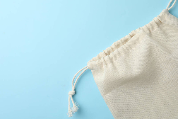 Cotton eco bag on light blue background, top view. Space for text - Fotografie, Obrázek