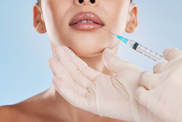 Beauty, collagen and a woman getting a lip injection from a medical worker. Plastic surgery, dermal filler and cosmetic treatment for youth. Modern medicine skincare and make up for natural good look. - Foto, Imagen