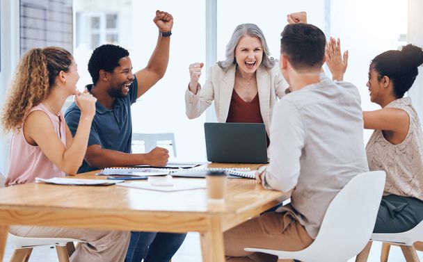 Business people celebration meeting goal, target and success while cheering during a meeting in a office. Advertising and marketing team happy about company profit and bonus salary from project. - Foto, Bild