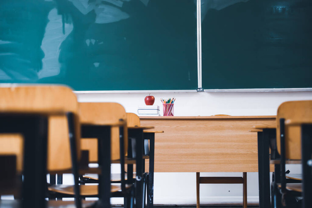 Back to School Concept. Empty classroom with chairs, desks and chalkboard. - Φωτογραφία, εικόνα