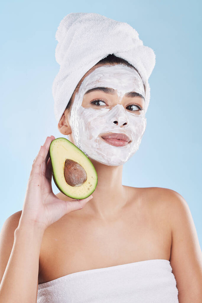 Avocado, skincare and woman with facial face mask for cleaning, detox and healthy pores in a beauty portrait. Wellness, peeling and dermatology cosmetics lotion for natural cream product treatment. - Foto, afbeelding