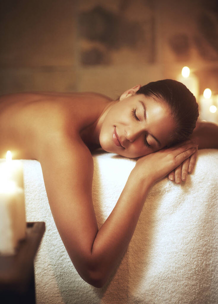 You are now entering a stress free zone. Closeup shot of a young woman relaxing during a spa treatment - Photo, image