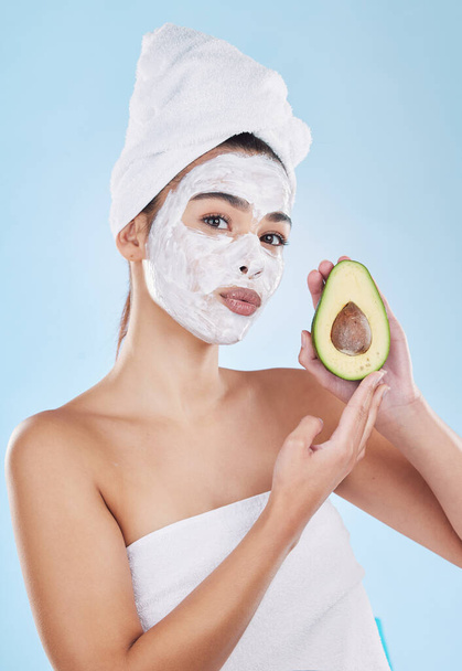 Skincare, beauty and avocado face mask with a beautiful woman taking care of her clean and healthy skin. Organic, fresh and cleansing facial with routine homemade treatment and natural ingredients. - Foto, immagini