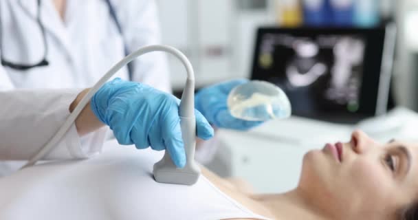 Predictive ultrasound mammography done gynecologist on a modern machine. Ultrasound medicine and breast silicone implants - Video, Çekim