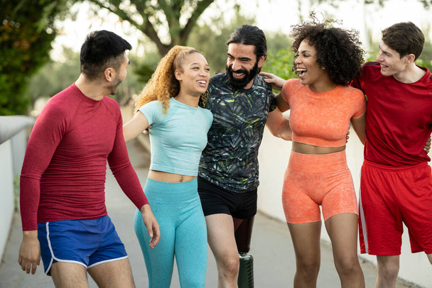 group of multiracial sporty friends happy as they start their training outdoors. - Zdjęcie, obraz