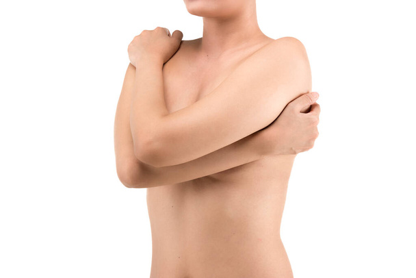 The woman holding her breast is isolated over white background. Breast cancer awareness - Photo, Image