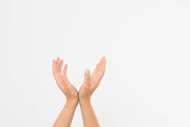 female hands measuring invisible items, woman's palm making gesture while showing small amount of something on white isolated background, side view, close-up, cutout, copy space - Photo, image