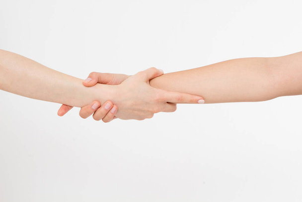 Two hands isolated. Helping hand to a friend. Copy space. Rescue or helping gesture of arms. - Photo, image