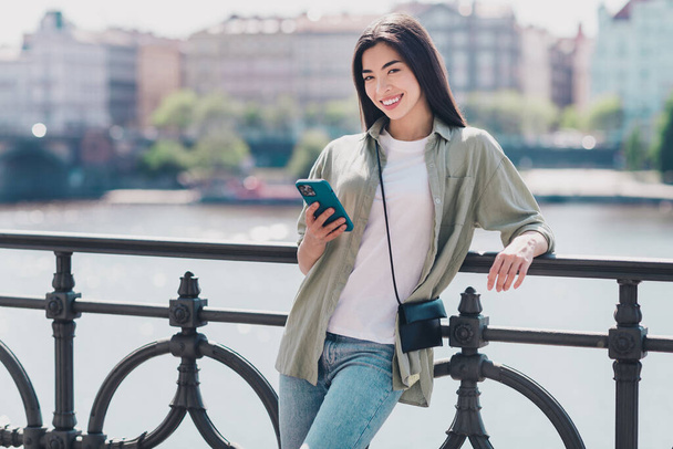 Photo of cute pretty girlfriend wear green outfit buying clothes modern gadget enjoying sunny weather outdoors city street. - Φωτογραφία, εικόνα