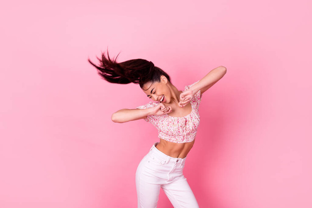 Photo of overjoyed pretty girl enjoy dancing partying good mood isolated on pink color background. - Фото, зображення