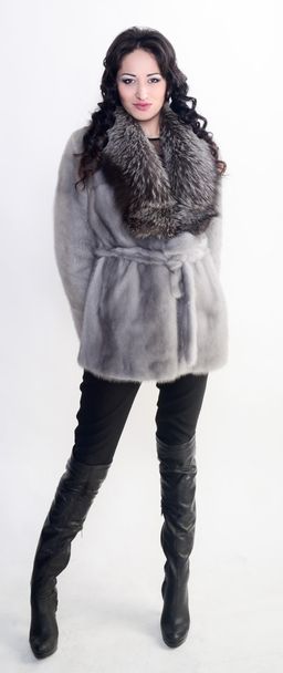 Female model in fur is standing - Фото, изображение