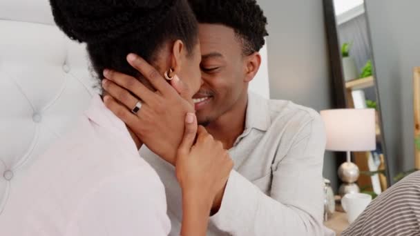 Marriage, happy and love couple in a bedroom, apartment or at getaway hotel. Romance, relax, intimate and romantic husband, wife or black people kissing on a honeymoon or valentines day anniversary. - Imágenes, Vídeo